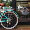 bicycle parked in front of neighborhood shop